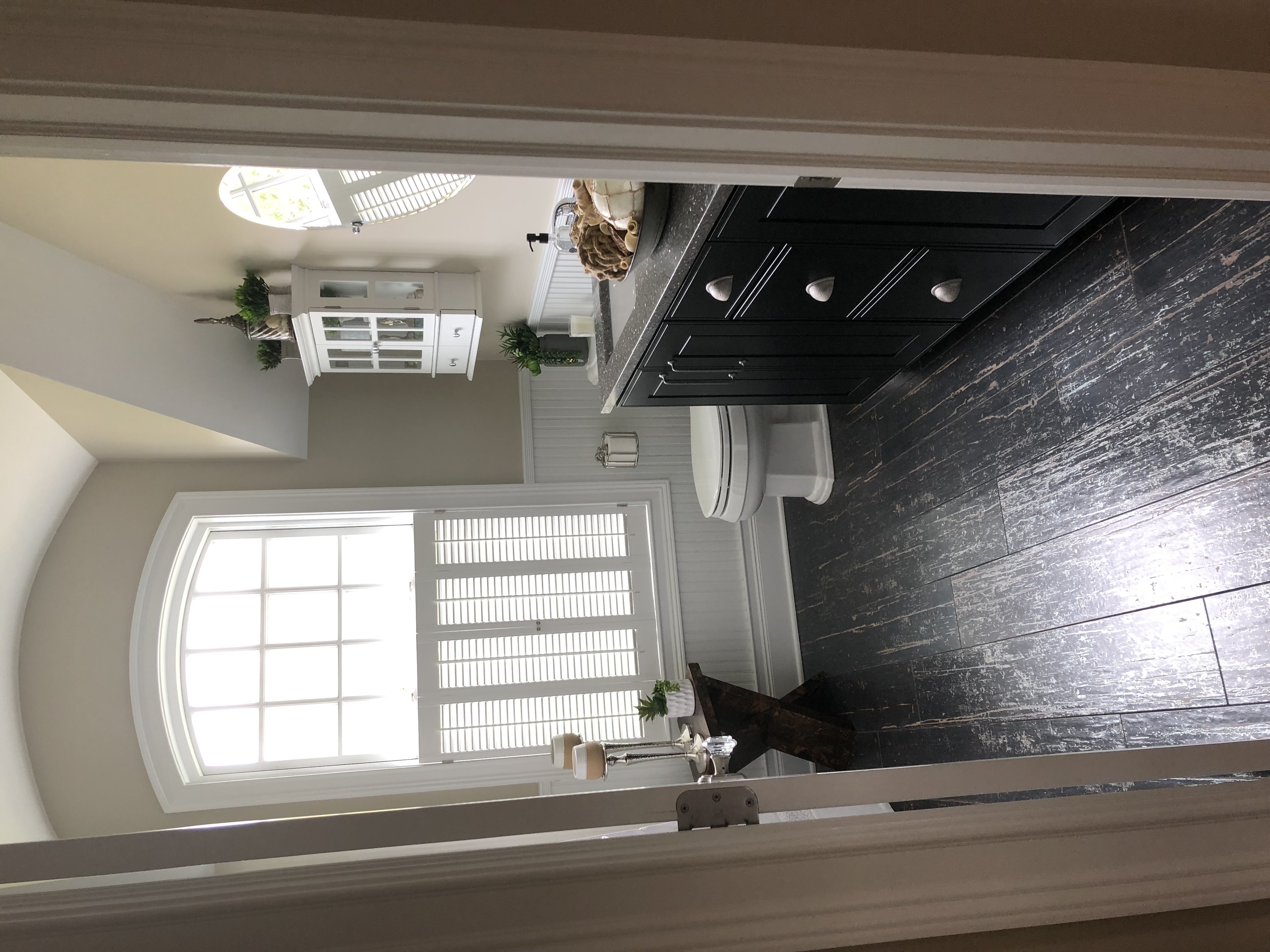 A view of a bathroom from the doorway looking in